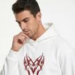 Man wearing a white hoodie with a red tribal design on a white background